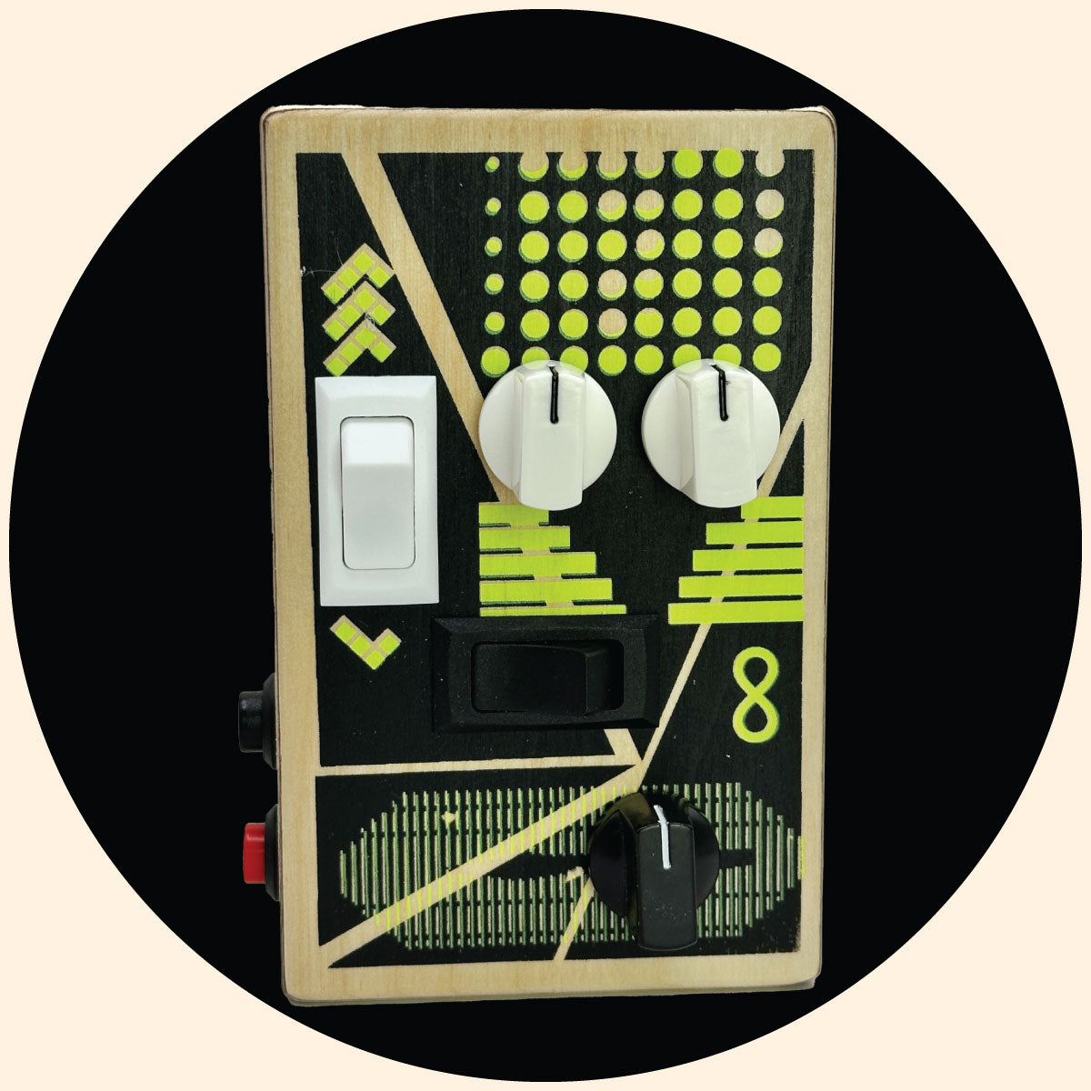 BrandNewNoise Reverse the Curse sound gadget with a lime and black graphic design screen printed on a baltic birch wood box that resembles a guitar pedal. White and black audio effects control knobs, red record button, black play button, white and black rocker switches