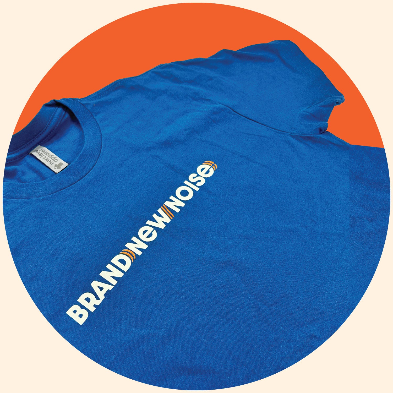 close up of BrandNewNOise logo on blue short sleeve t-shirt