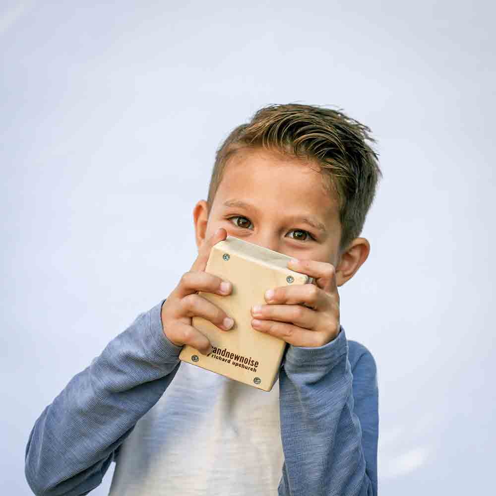 Cute kid playing with musical toy by BrandNewNoise