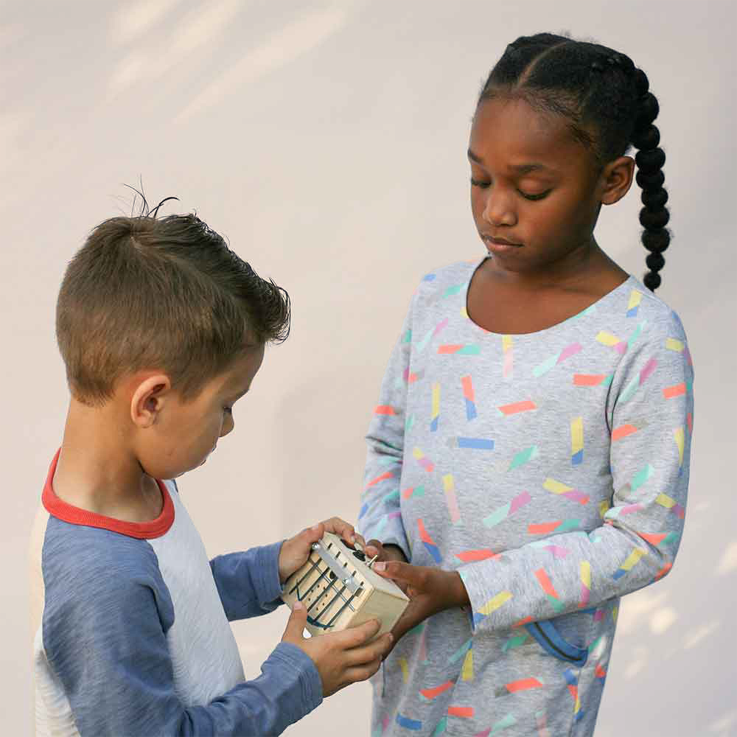 children playing with handmade kalimba by BrandNewNoise